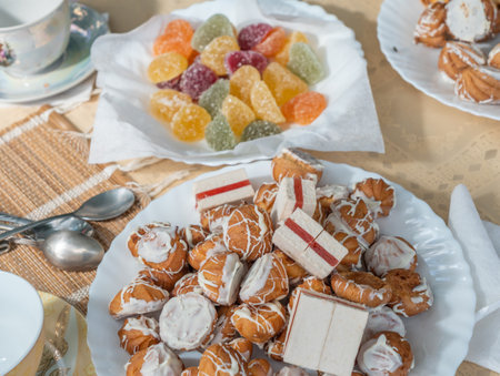 Close-up of assorted sweets on a white plate in a restaurantの写真素材