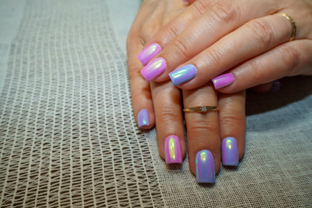 Female hands with bright nail design. Nail polish manicure.