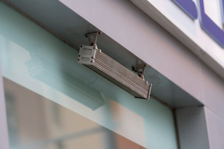 Close up of modern LED outdoor light fixture mounted on building facade. Exterior architectural lighting detail.の写真素材