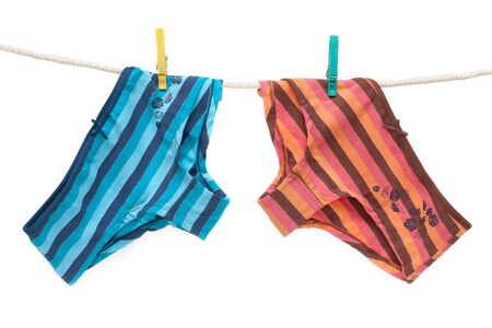 Feminine colour panties hung on linen rope, isolatの写真素材