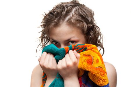 Making look younger girl with wet hair looks from for towel on white backgroundの写真素材