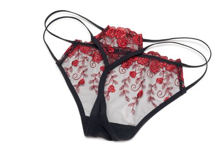 Black feminine panties with red embroidery of the strapの写真素材