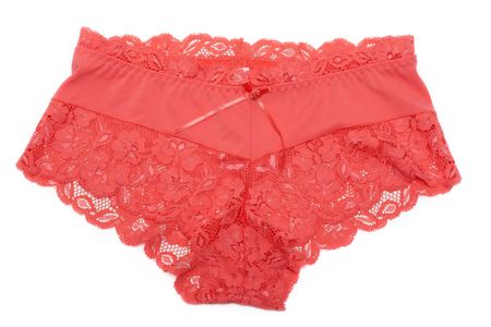 Red feminine lacy panties on white backgroundの写真素材