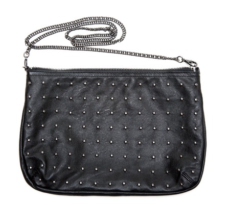 Black leather feminine bag with chain on white backgroundの写真素材