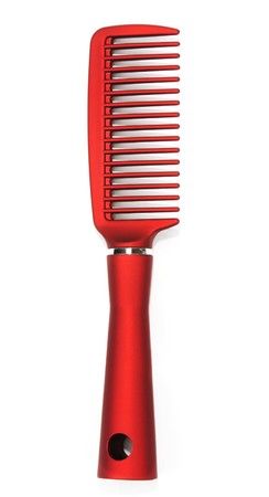 Massage red comb insulated on white backgroundの写真素材