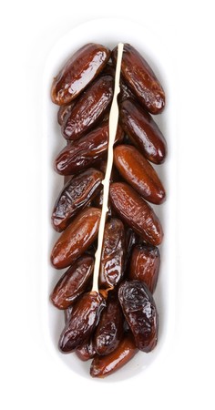Dates in plastic packing insulated on white background