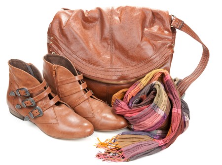 Brown leather bag, scarf and pair feminine boots on white backgroundの写真素材