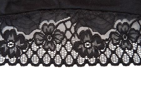 Decorative white lace on insulated black backgroundの写真素材