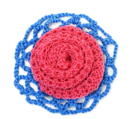 Knitted roses of red and blue threadの写真素材