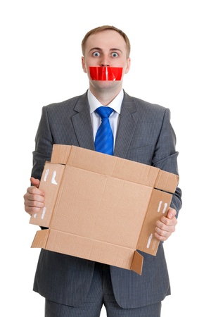 Businessman separates the red tape from his mouthの写真素材
