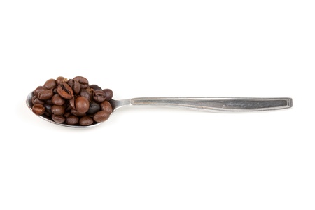 spoon with coffee beans isolated on white backgroundの写真素材