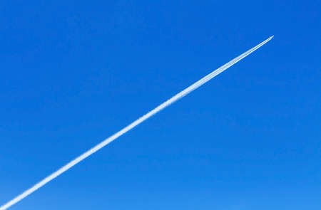trace of an airplane against blue sky