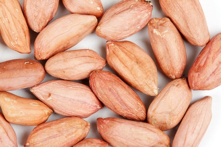 background as spilling peanut on a light backgroundの写真素材