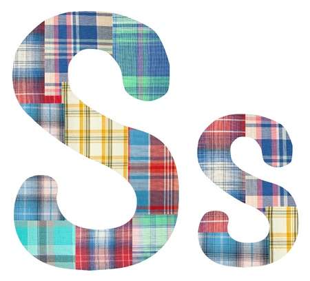 collage letter S made of color checkered fabric patcheson a white backgroundの写真素材