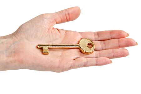 woman's hand with a key, isolated on a white backgroundの写真素材