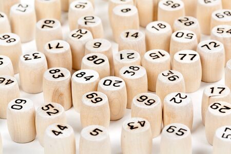 wooden barrels with lotto numbers on a white backgroundの写真素材