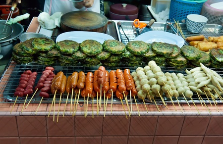 Asian street food tray with skewers, hot dogsのeditorial素材