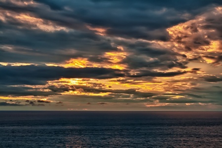 sunset on an overcast sea in the Andaman Seaの写真素材