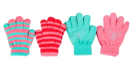 Striped baby gloves isolated on white backgroundの写真素材