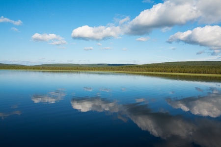 natural reflections on a lake and beautiful cloudsの写真素材