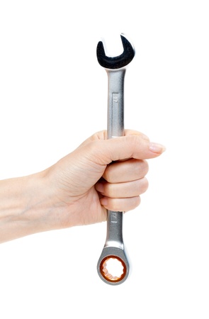 Woman's hand holding a chrome wrench. Isolate on white.の写真素材