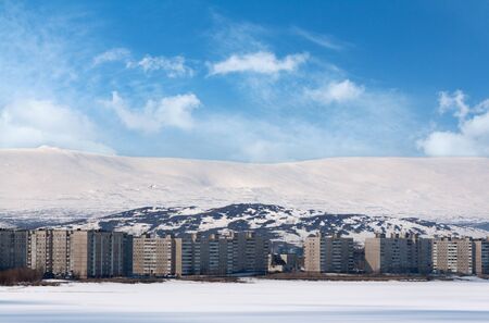 apartment buildings in the mountains in winterの写真素材