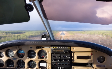 Cockpit view from small aircraft taking off from runwayの写真素材