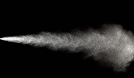 Spraying of water in motion on black backgroundの写真素材