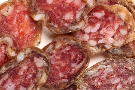 Fouette sausage sliced close up, isolate on a whiteの写真素材