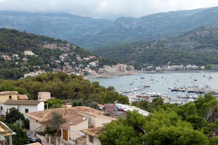 Port with yachts in the bay in the mountainsの写真素材