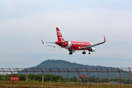 Phuket, Thailand. February 02, 2017. Air Asia Reg.HS-BBL Over Mai Khao Sea Beach for Landing at Phuket International Airportのeditorial素材