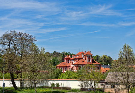 House with a tiled roof against a blue skyの写真素材
