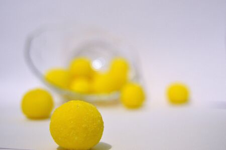 Yellow candy on the tableの写真素材