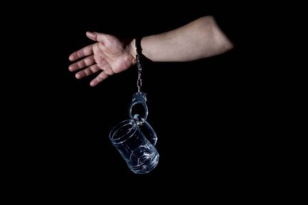 alcohol is harmful to health, alcoholism is a disease, a person dependent on alcoholの写真素材