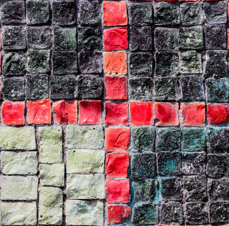 Colorful wall with dark and colored stones background for design.の写真素材