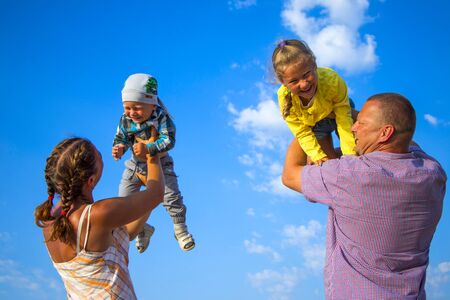 happy family of parents and children on the sky background Bulgaria Varna 25.09.2018のeditorial素材