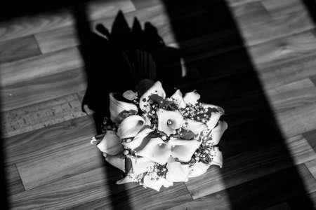 bouquet of white lilies in the sunの写真素材