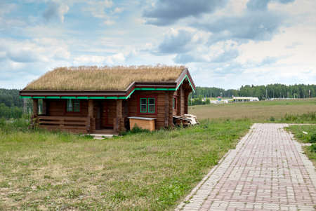 Moscow region, Russia - June 24, 2007: Small wooden house near Golod Pyramid. Located near Moscow - Riga highwayのeditorial素材