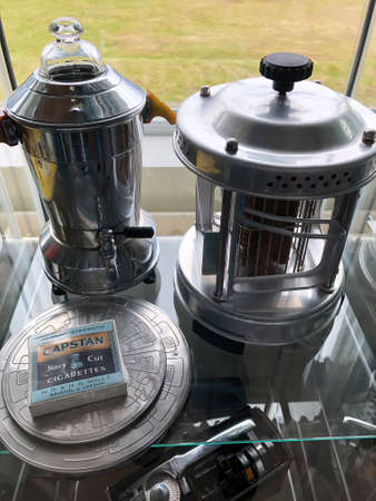 Hladir, Iceland - July 4, 2018: Vintage kettle, heater and cigarette box. Hladir, Hvalfjardarstrond, Akranes region, Icelandのeditorial素材