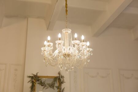 Chandelier in a white room in a classic designの写真素材