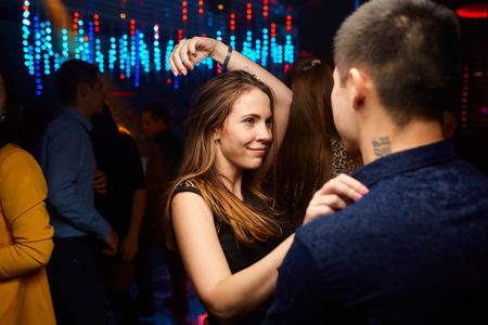 many people in the club laughing at a nightclub
