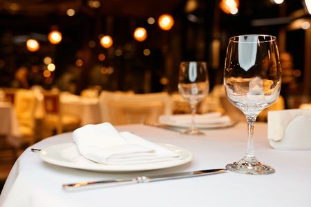 glasses on a table in a restaurantの写真素材