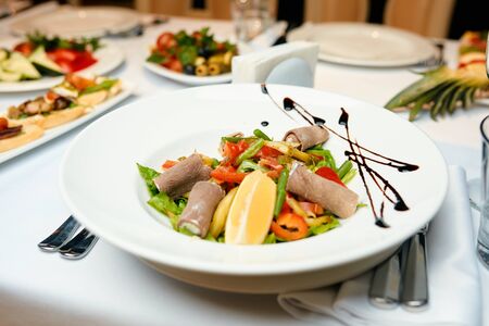 salad on a table in a restaurantの写真素材