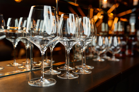 glasses on a table in a restaurantの写真素材