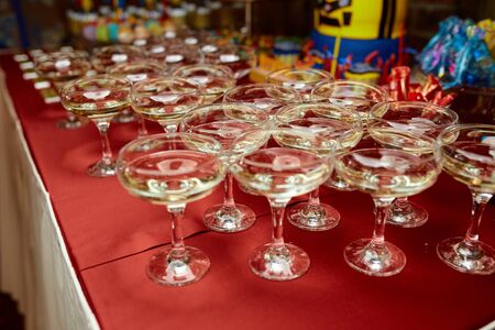 glasses on a table in a restaurantの写真素材