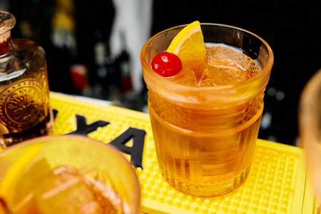 Photo of a cocktail with orange on the bar counterの写真素材