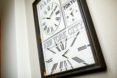 Photo of hours that show the time of several cities