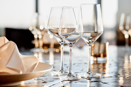 empty glasses on the table with a beautiful background in a restaurantの写真素材