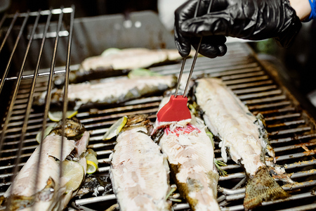 cleaned white fish with lime ready to stew next to the panの写真素材