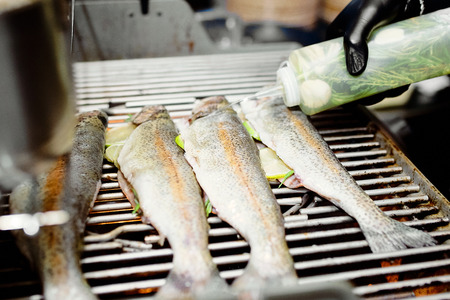 cleaned white fish with lime ready to stew next to the panの写真素材